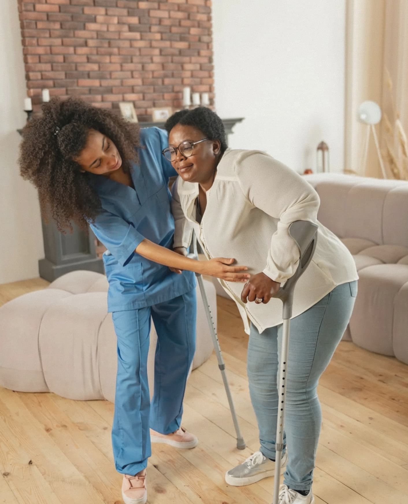 Home caregiver helping senior woman walk safely with mobility assistance