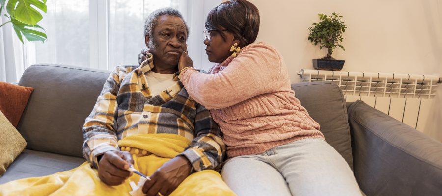 senior couple, sick man, his wife takes care of him