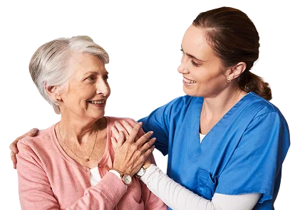 Caregiver comforting elderly woman