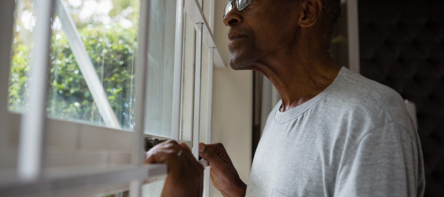 senior-man-gazing-through-window-in-quiet-thought-2026-01-11-10-31-10-utc