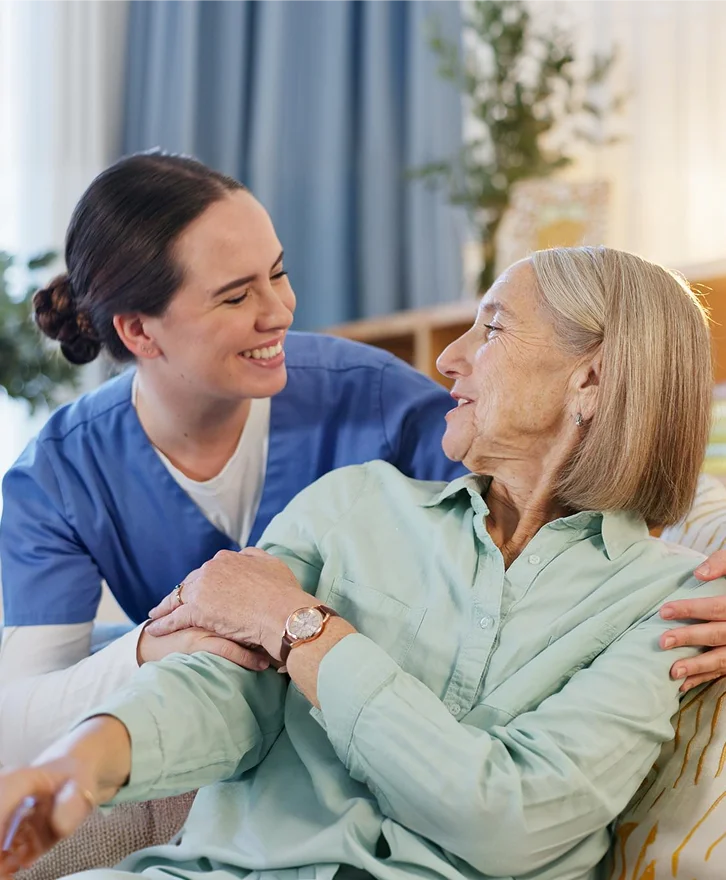 Caregiver sharing a moment with an elderly woman