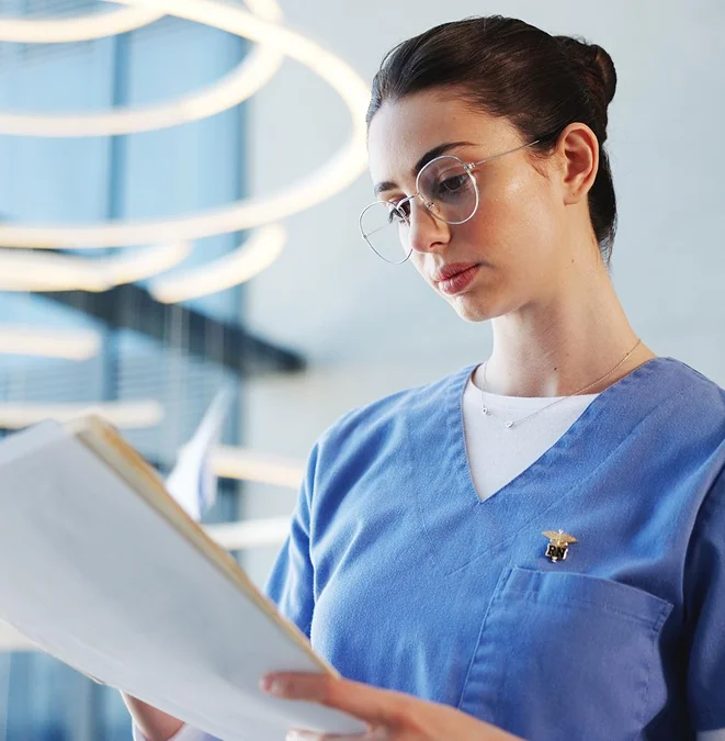 Nurse reviewing patient paperwork