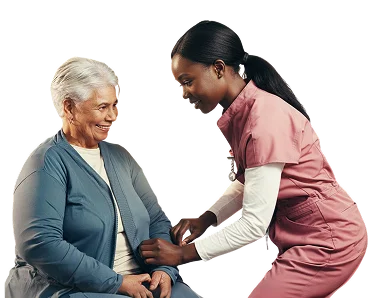 Caregiver assisting an elderly woman with dressing