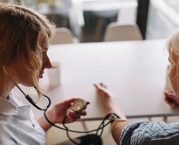 Caregiver checking a senior patient's blood pressure