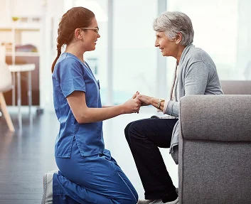 Caregiver shaking hands with a senior man