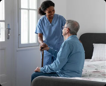 Caregiver visiting a senior man at home